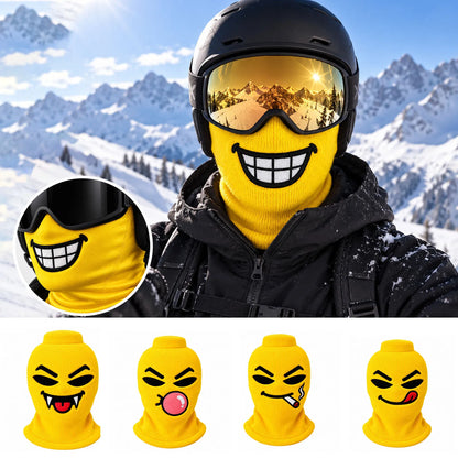 Skier wearing a yellow Maskot cartoon face balaclava on the mountain, with all four Maskot faces